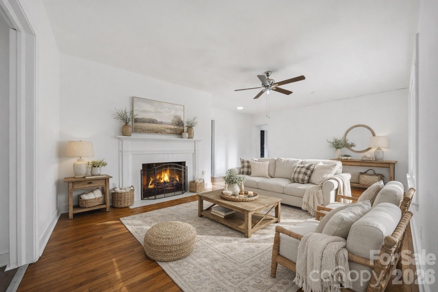 915 Airport Road Shelby, NC 28150 - Photo 5 of 37 a living room with furniture a fireplace and a ceiling fan