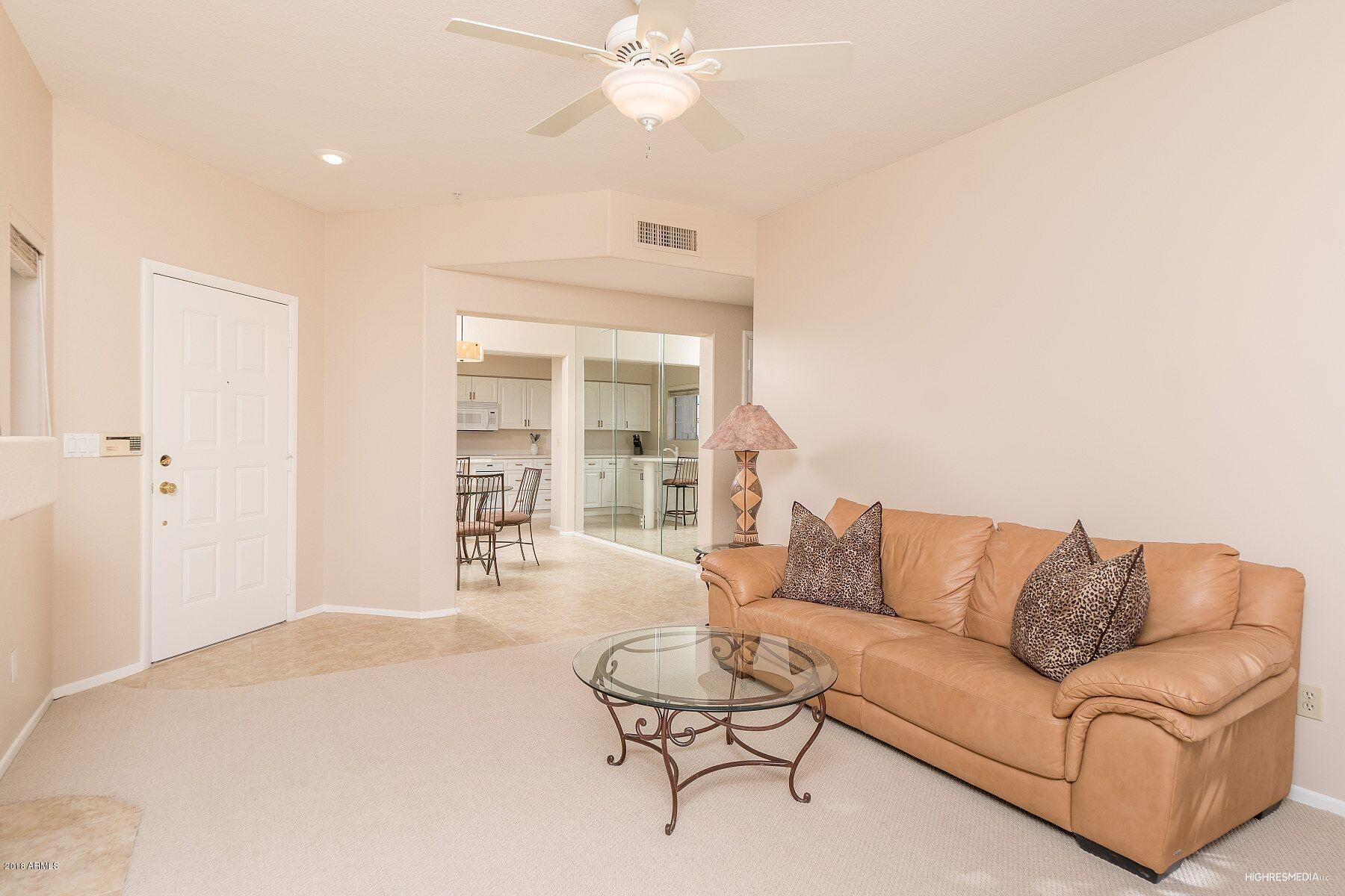 7710 East Gainey Ranch Road, Unit 225 Scottsdale, AZ 85258 - Photo 7 of 26 Living room and hallway