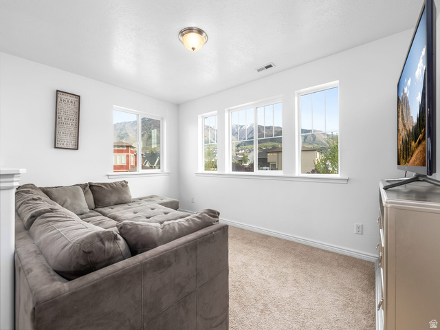 256 West Horizon Loop Payson, UT 84651 - Photo 14 of 33 Living area with baseboards and light carpet