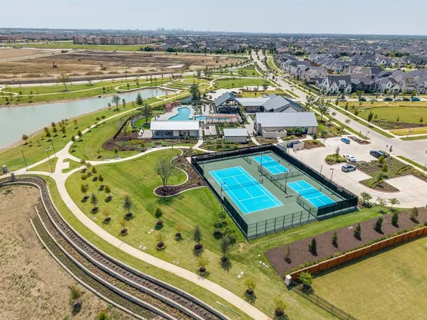 an aerial view of a house with a swimming pool
