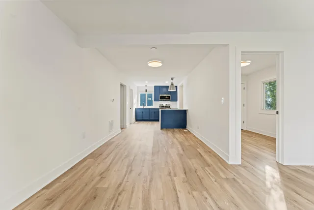 a view of kitchen with wooden floor