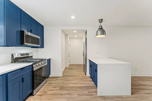 a kitchen with a stove and a sink