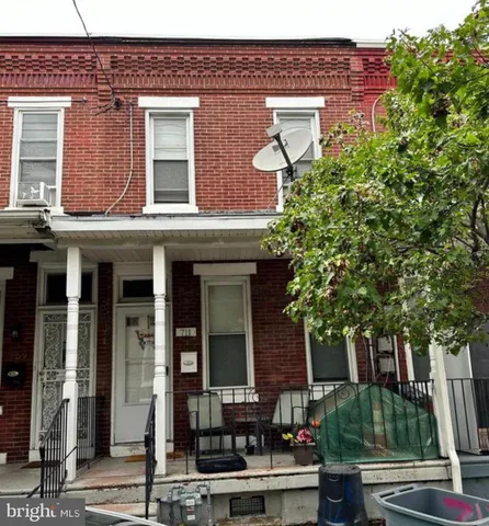 a front view of a building with garden