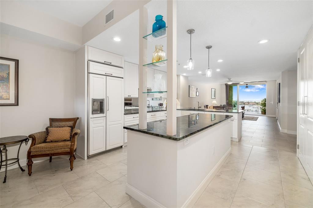 610 Riviera Dunes Way, Unit 503 Palmetto, FL 34221 - Photo 14 of 58 a large white kitchen with a large window