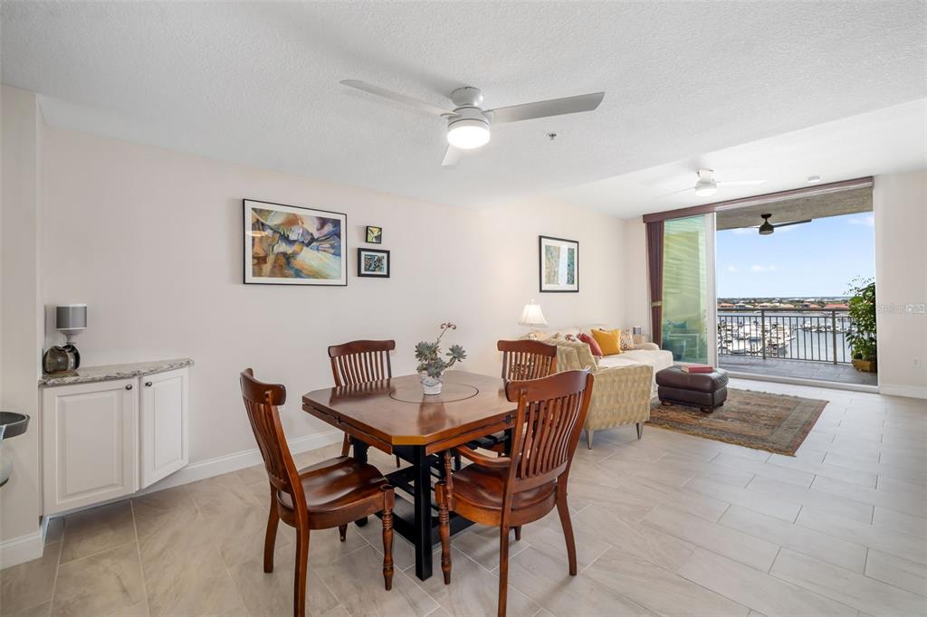 610 Riviera Dunes Way, Unit 503 Palmetto, FL 34221 - Photo 23 of 58 a dining room with furniture and window