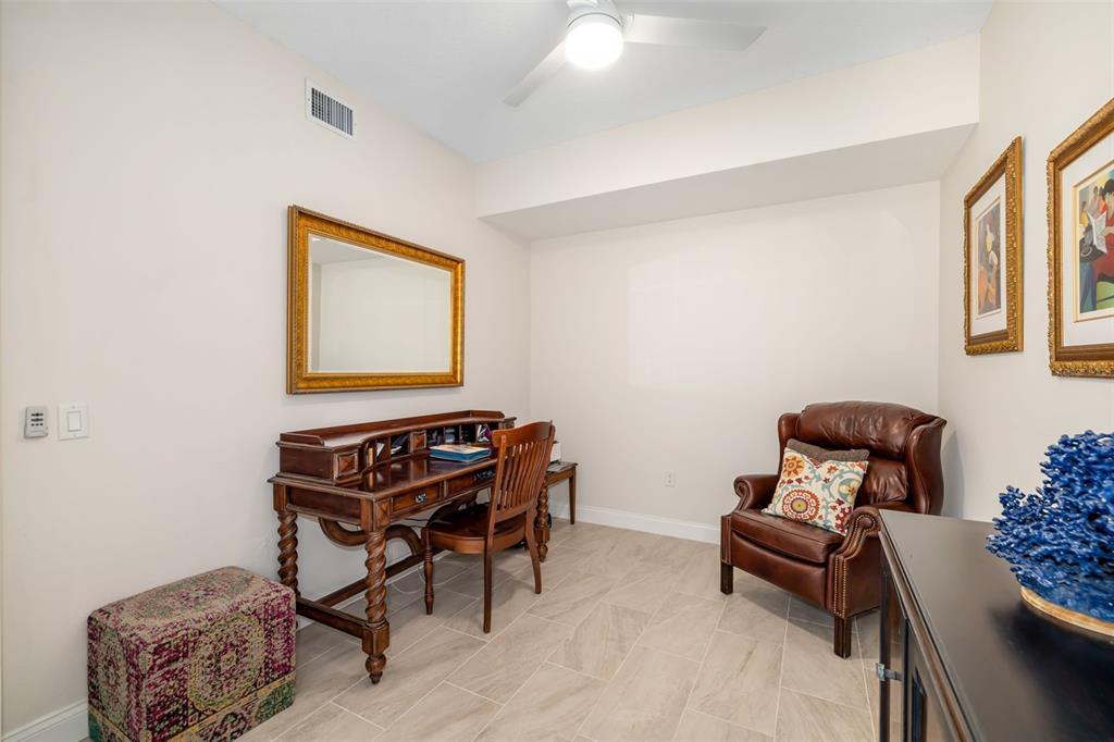 610 Riviera Dunes Way, Unit 503 Palmetto, FL 34221 - Photo 24 of 58 a room with furniture and a window