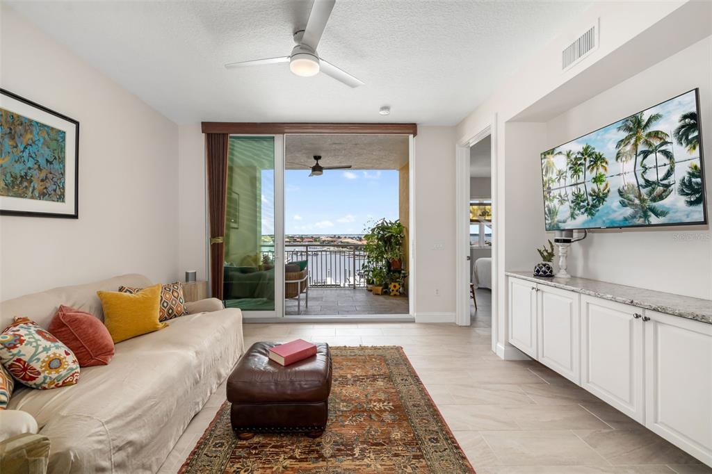 610 Riviera Dunes Way, Unit 503 Palmetto, FL 34221 - Photo 25 of 58 a living room with furniture and a large window