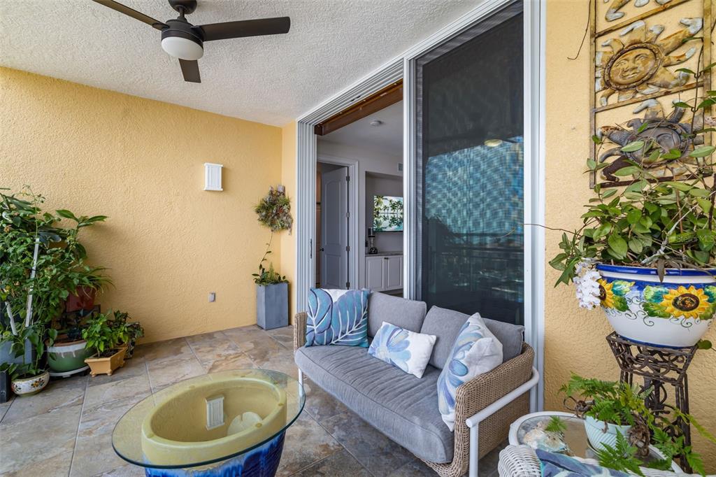 610 Riviera Dunes Way, Unit 503 Palmetto, FL 34221 - Photo 39 of 58 a living room with furniture and a potted plant