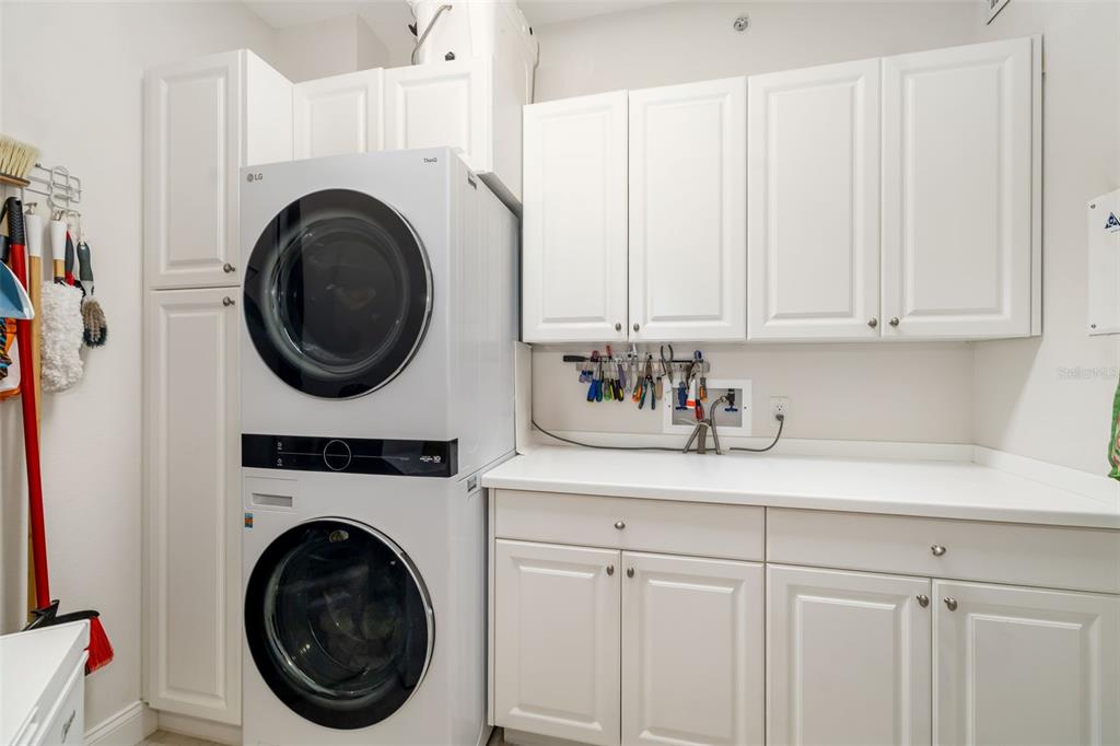 610 Riviera Dunes Way, Unit 503 Palmetto, FL 34221 - Photo 40 of 58 a utility room with sink dryer and washer