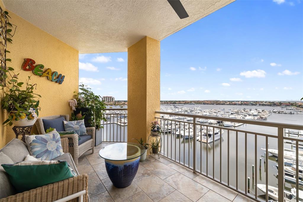 610 Riviera Dunes Way, Unit 503 Palmetto, FL 34221 - Photo 10 of 58 a view of a terrace with couches and potted plants