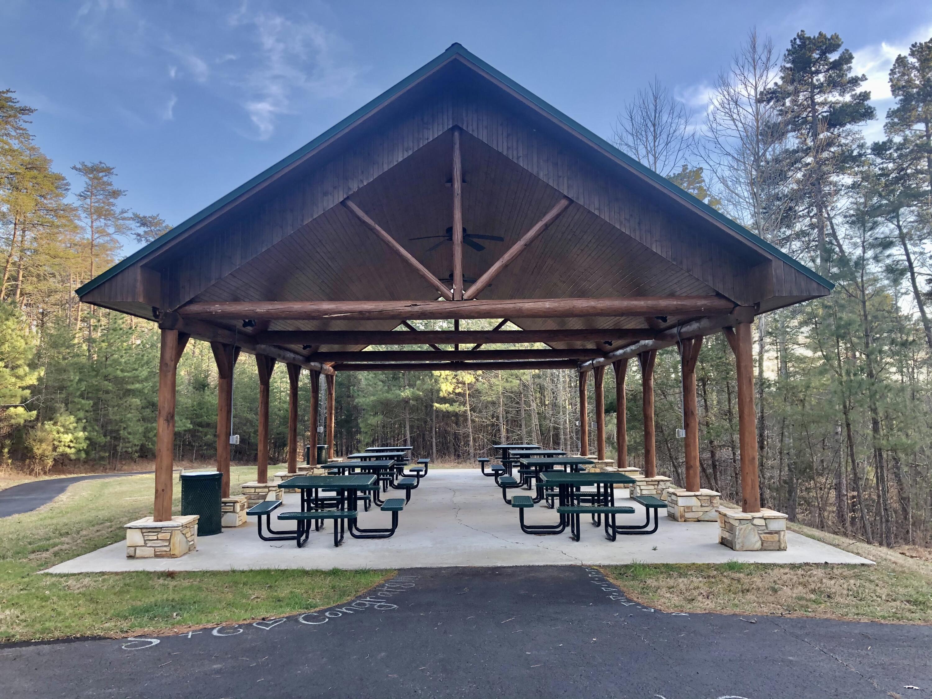 Lot 332 Bay View Road Lynch Station, VA 24571 - Photo 9 of 10 a view of a patio with table and chairs under an umbrella