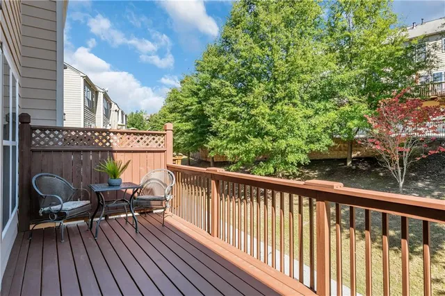 a view of balcony with furniture and wooden deck