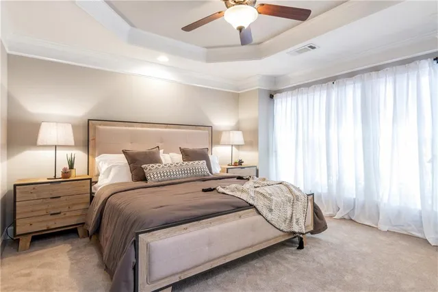 a bed room with a bed and a night stand