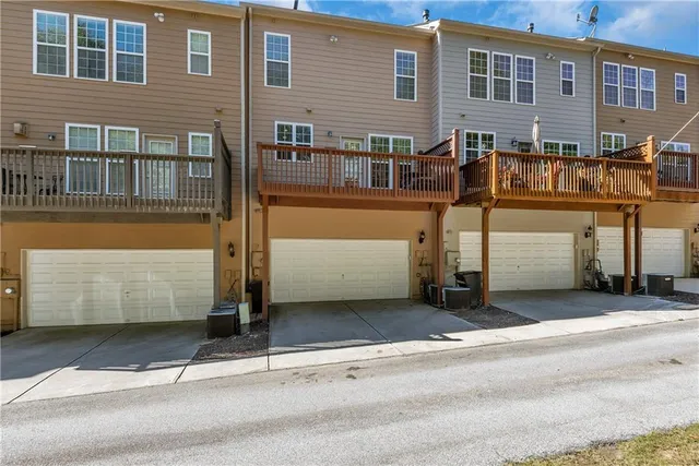 a front view of a building with a garage