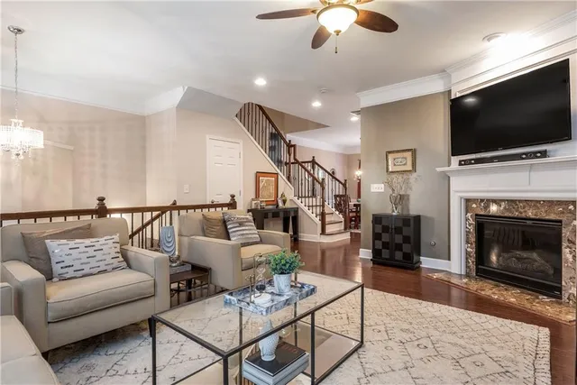 a living room with furniture fireplace and flat screen tv