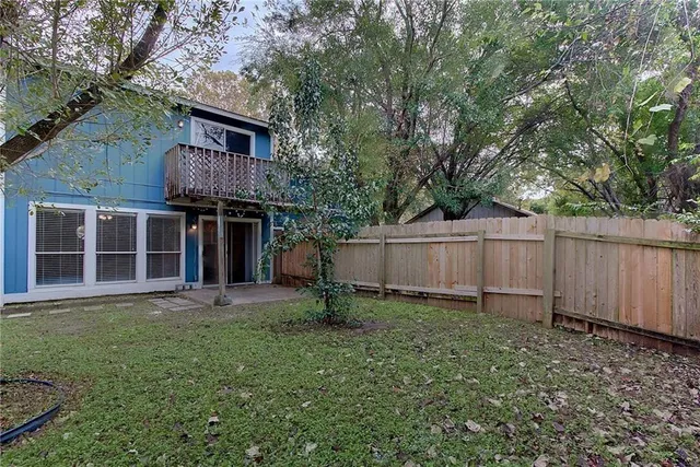 a backyard of a house with lots of green space