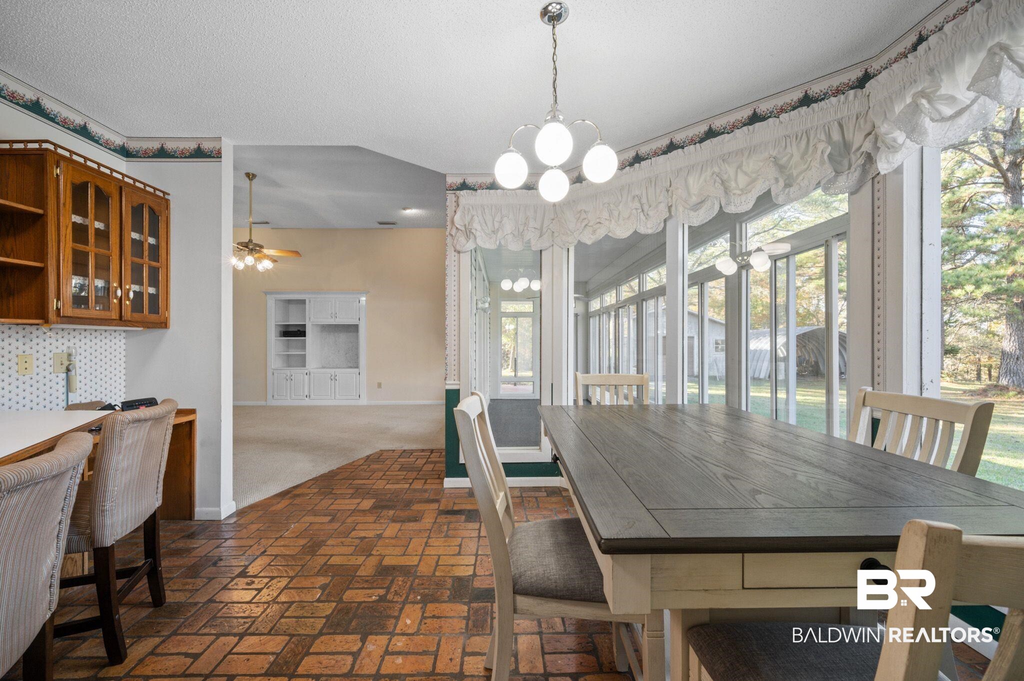 15801 Maytower Road Bay Minette, AL 36507 - Photo 15 of 43 Dining area with ceiling fan with notable chandelier