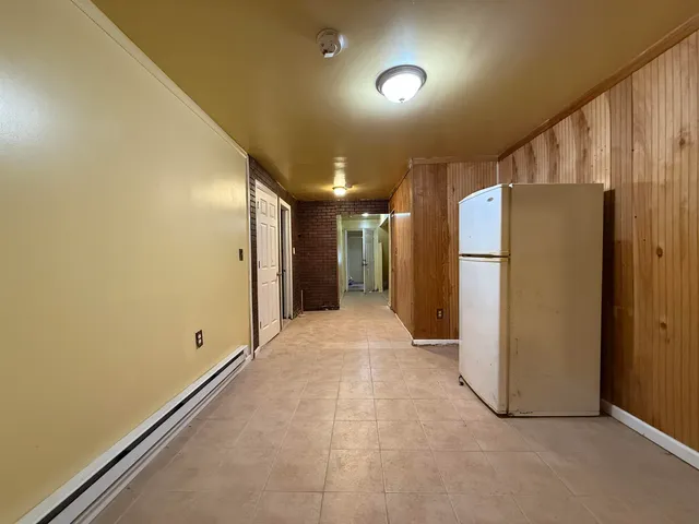 a view of a hallway with an empty room