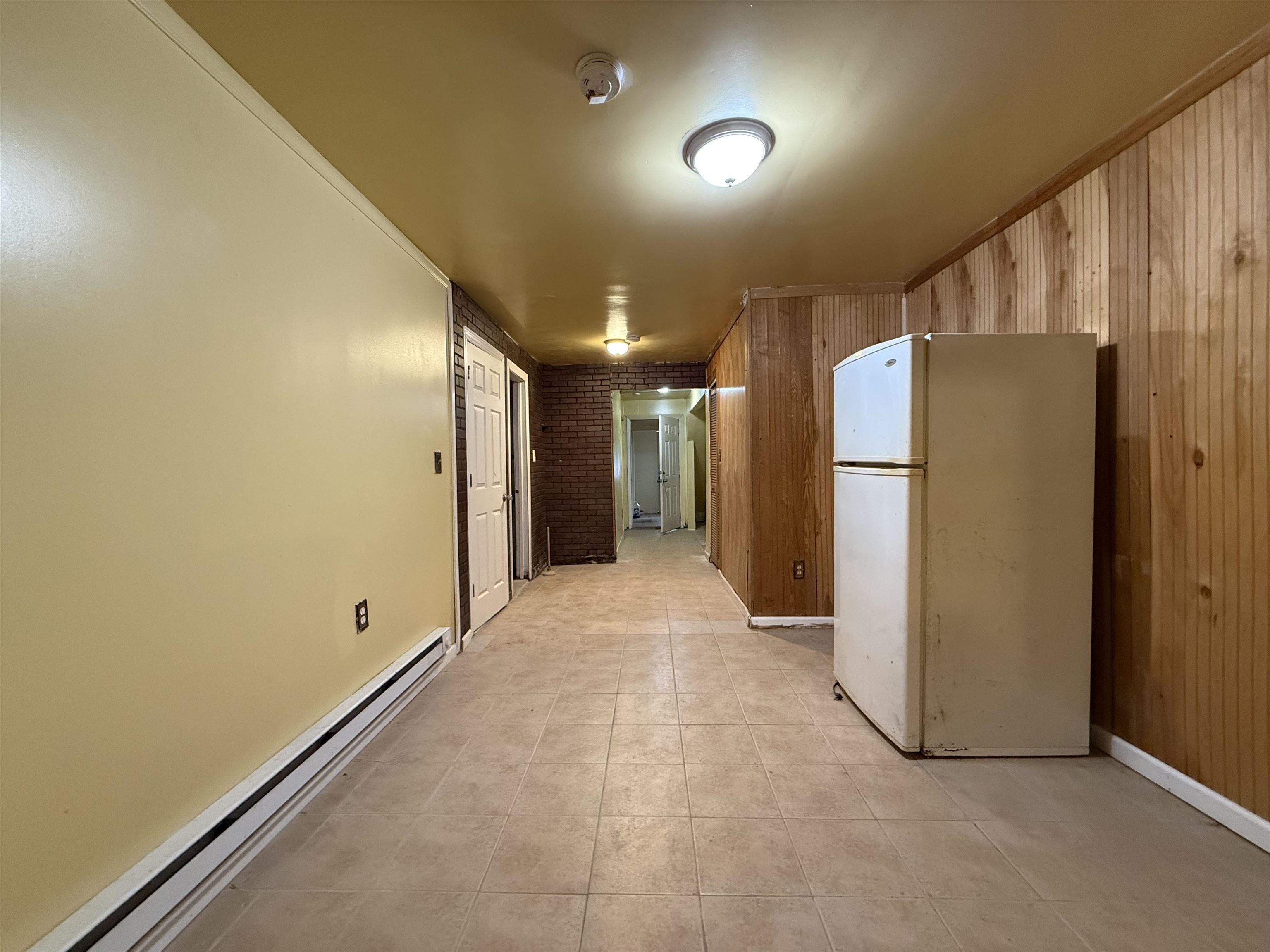20 Dales Avenue, Unit 1 Jersey City, NJ 07306 - Photo 13 of 15 a view of a hallway with an empty room