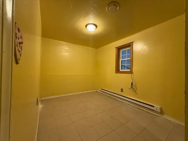 a kitchen with granite countertop a sink and cabinets