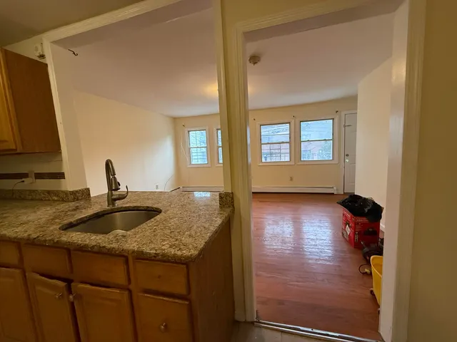 a kitchen with sink and window