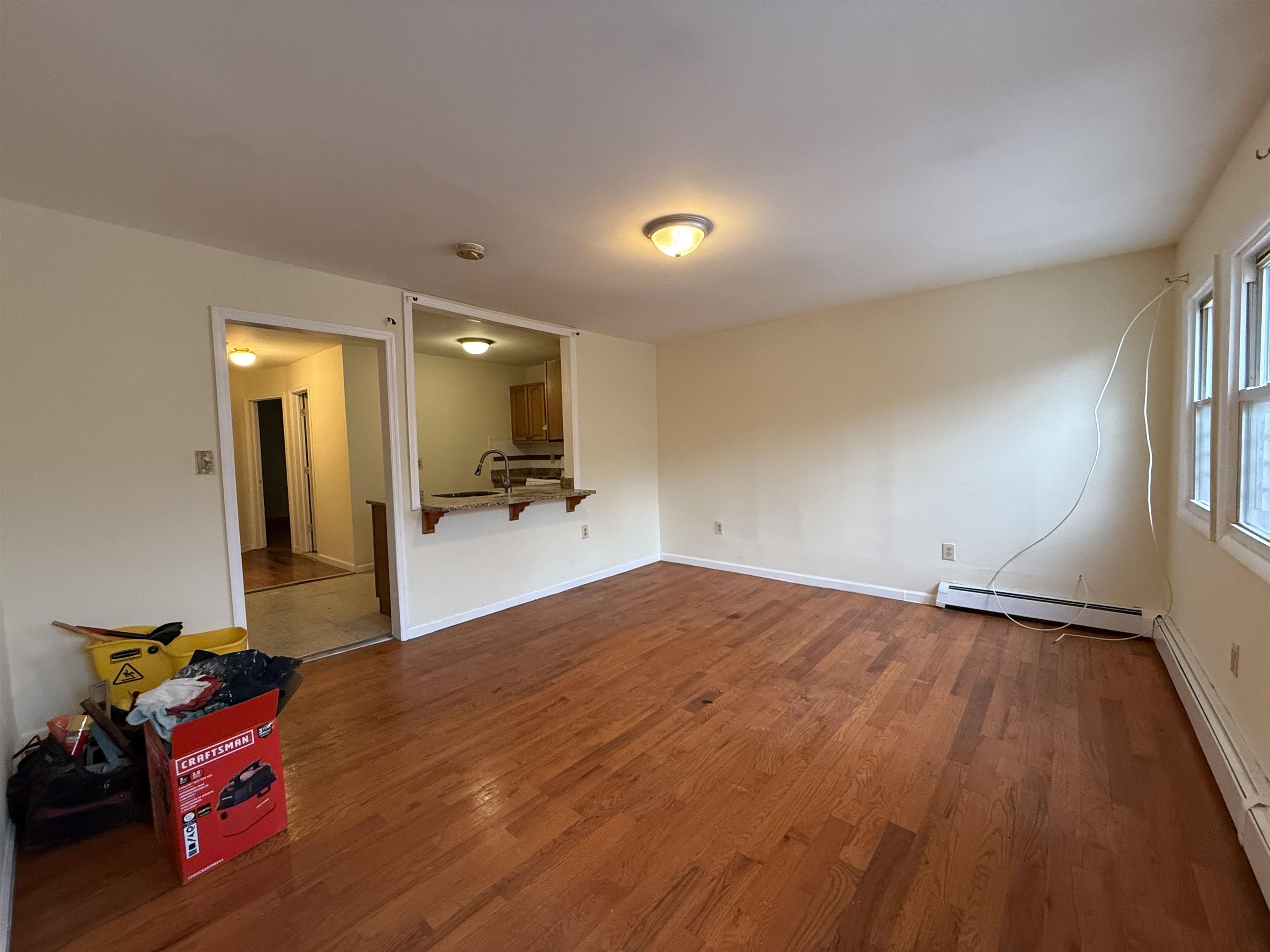 20 Dales Avenue, Unit 1 Jersey City, NJ 07306 - Photo 5 of 15 a view of a room with toys and wooden floor