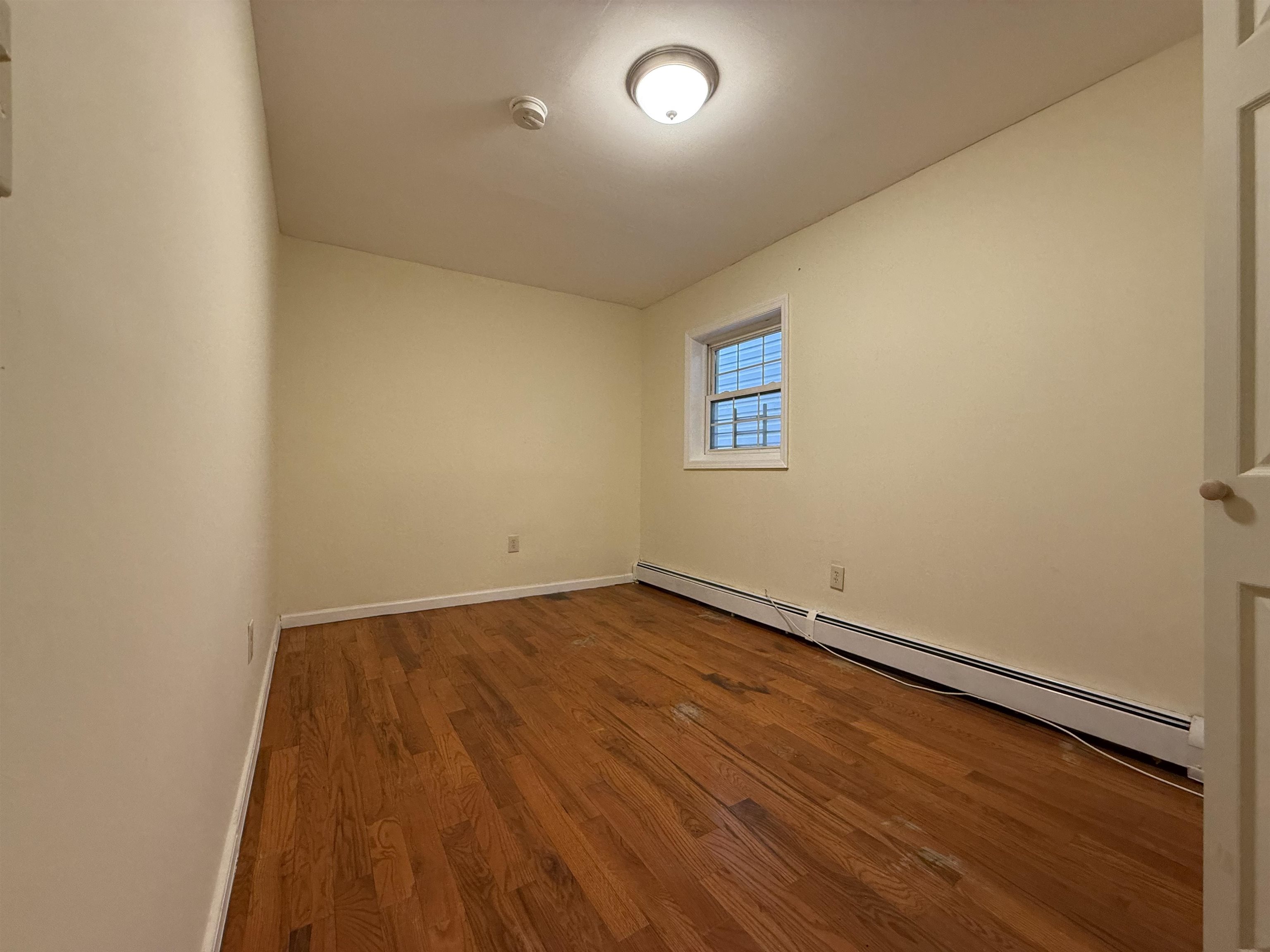 20 Dales Avenue, Unit 1 Jersey City, NJ 07306 - Photo 7 of 15 an empty room with a window