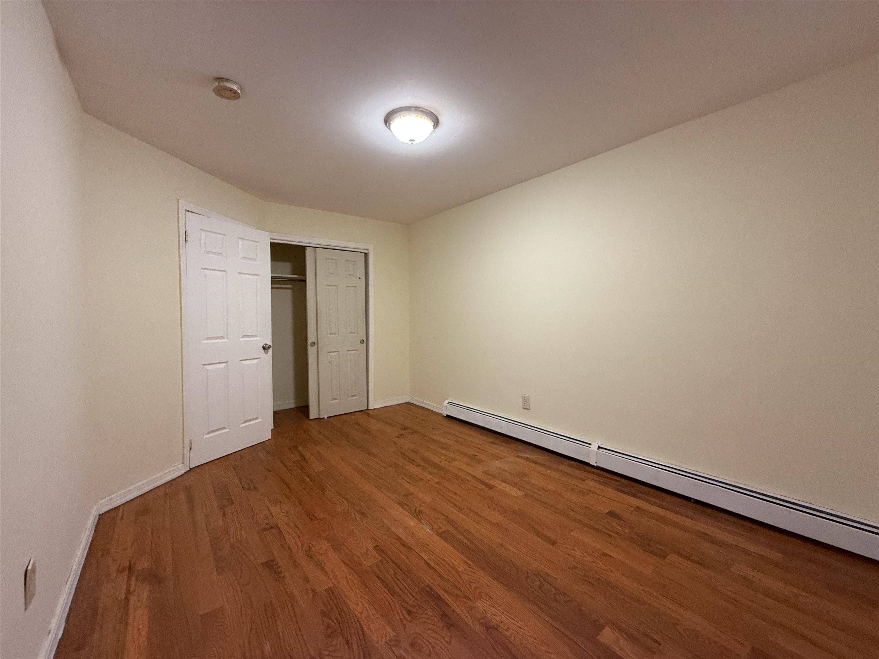 20 Dales Avenue, Unit 1 Jersey City, NJ 07306 - Photo 9 of 15 a view of empty room with wooden floor