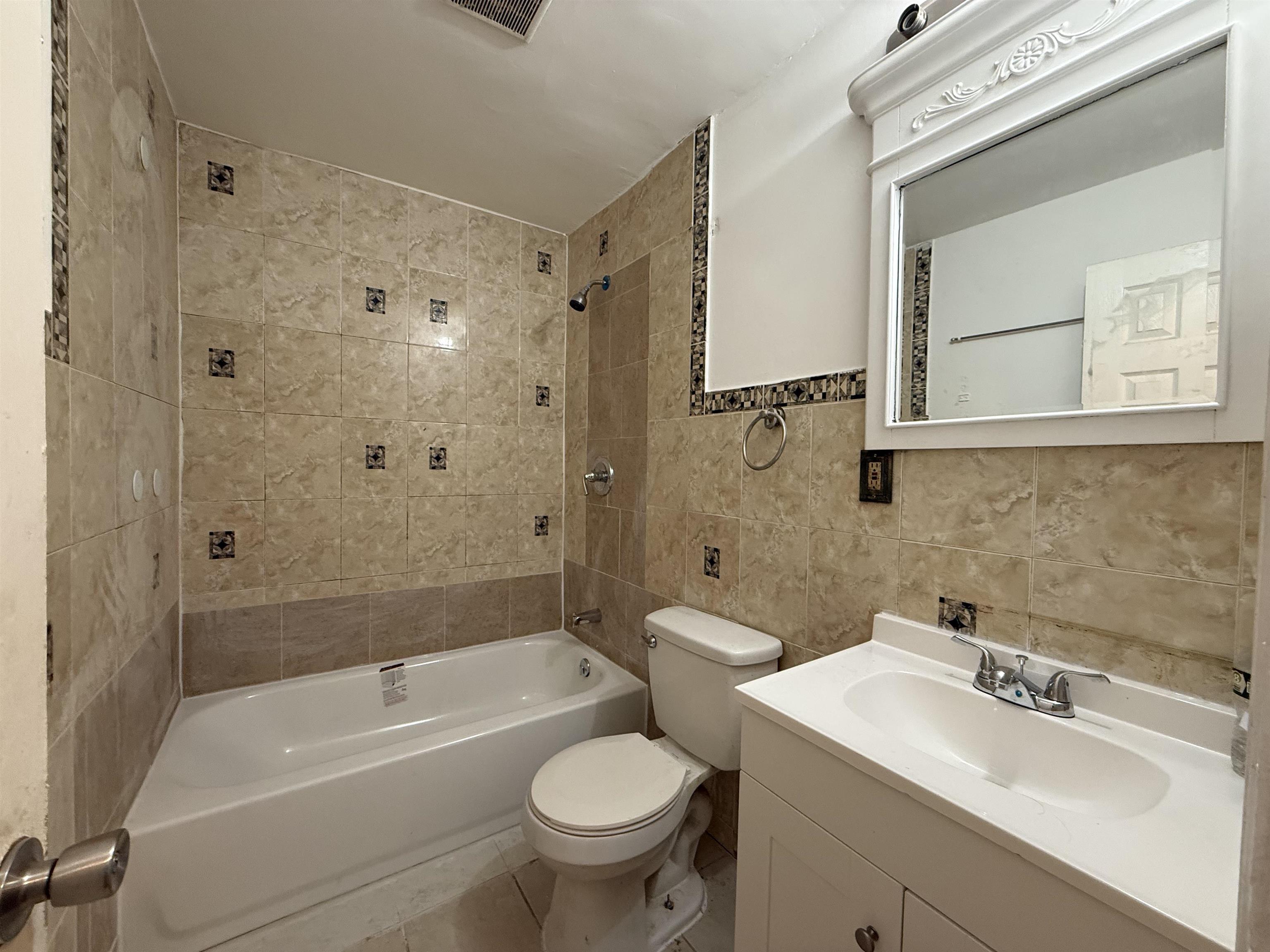 20 Dales Avenue, Unit 1 Jersey City, NJ 07306 - Photo 10 of 15 a bathroom with a sink toilet and shower