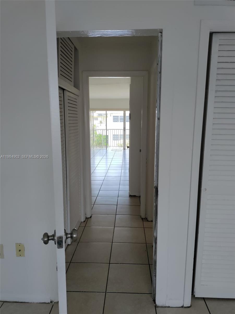 7340 Southwest 82nd Street, Unit C205 Miami, FL 33143 - Photo 14 of 34 a view of a hallway