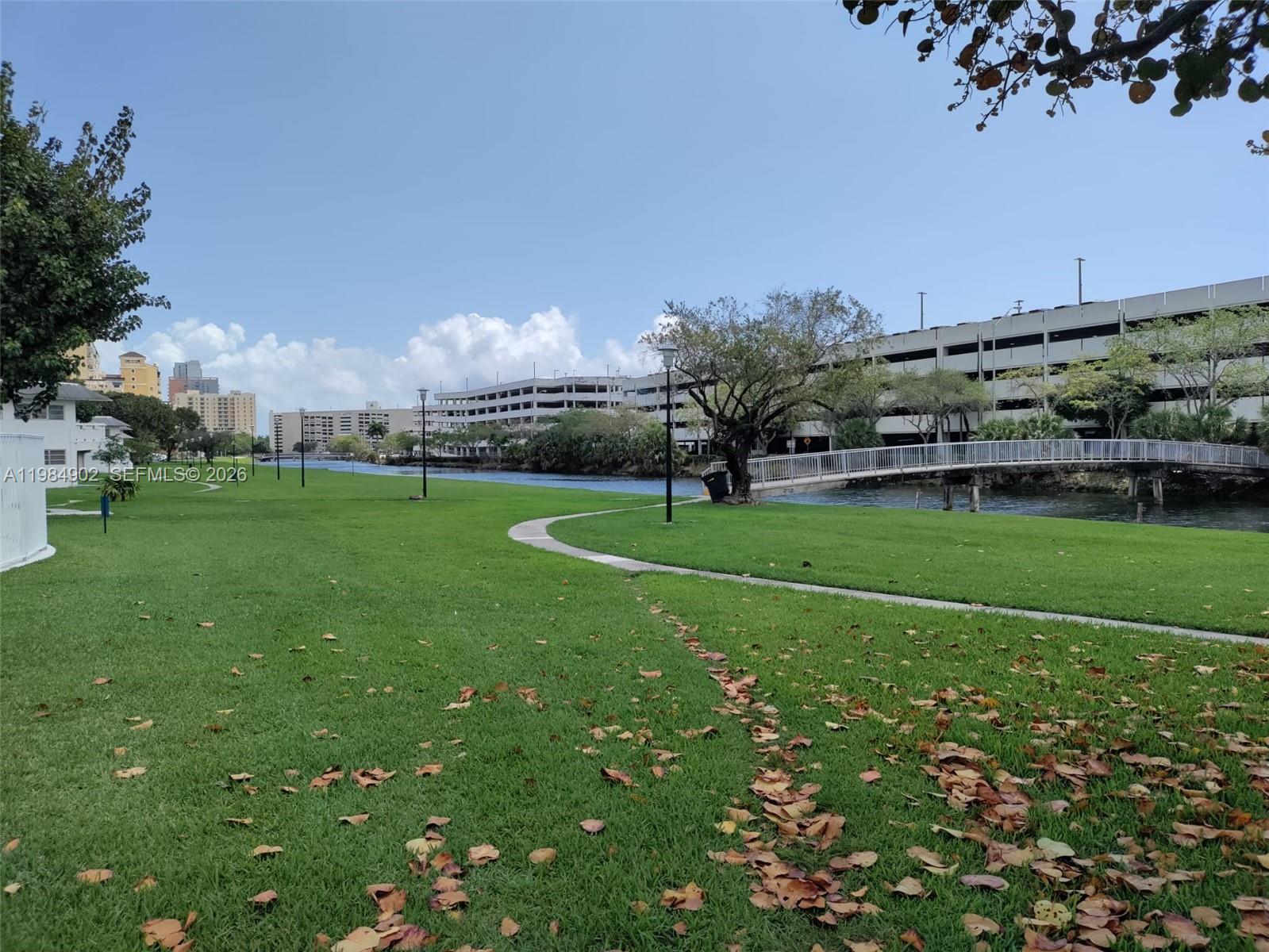 7340 Southwest 82nd Street, Unit C205 Miami, FL 33143 - Photo 22 of 34 a view of a golf course with a lake