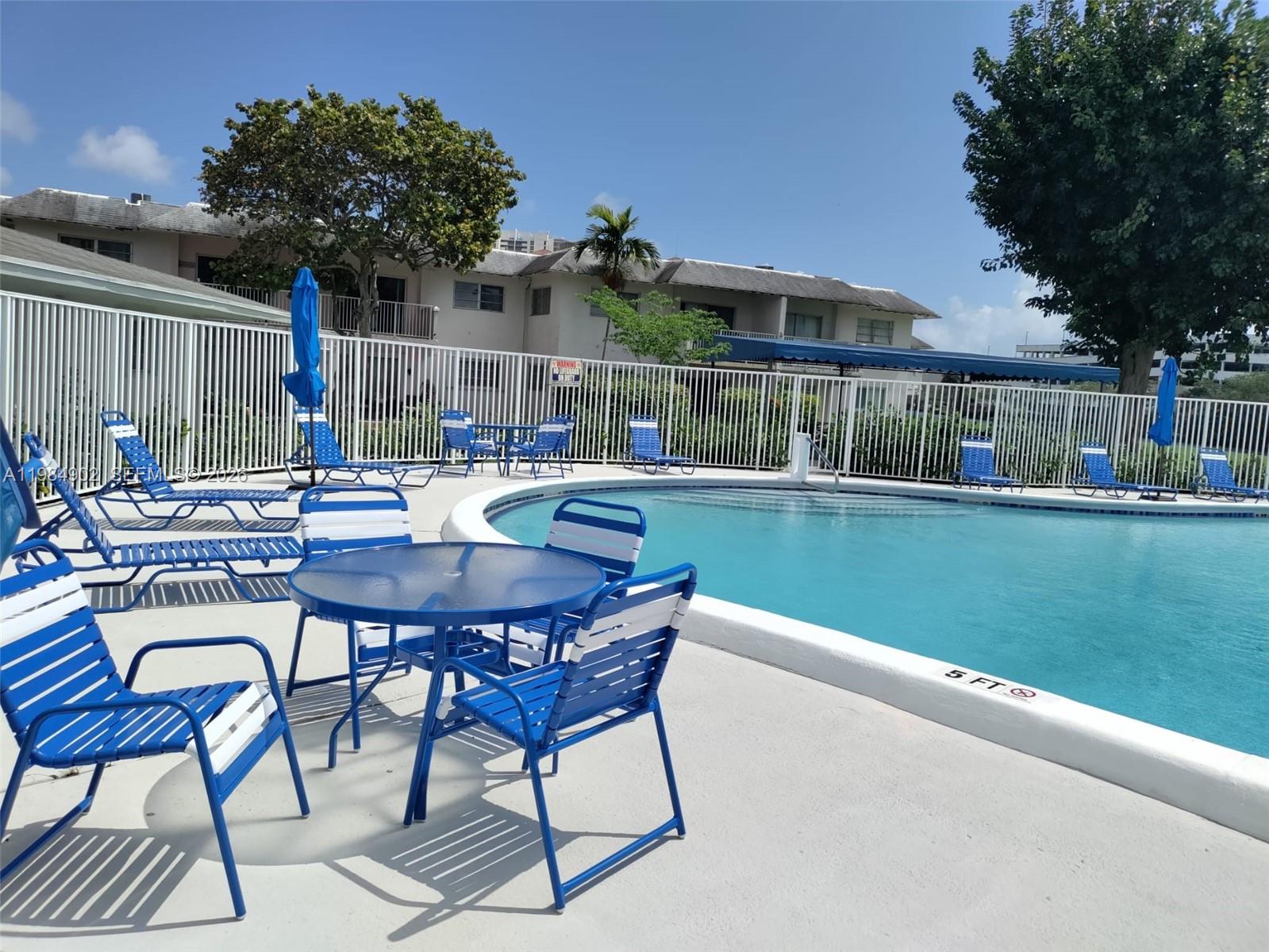 7340 Southwest 82nd Street, Unit C205 Miami, FL 33143 - Photo 25 of 34 a view of a house with backyard and sitting area