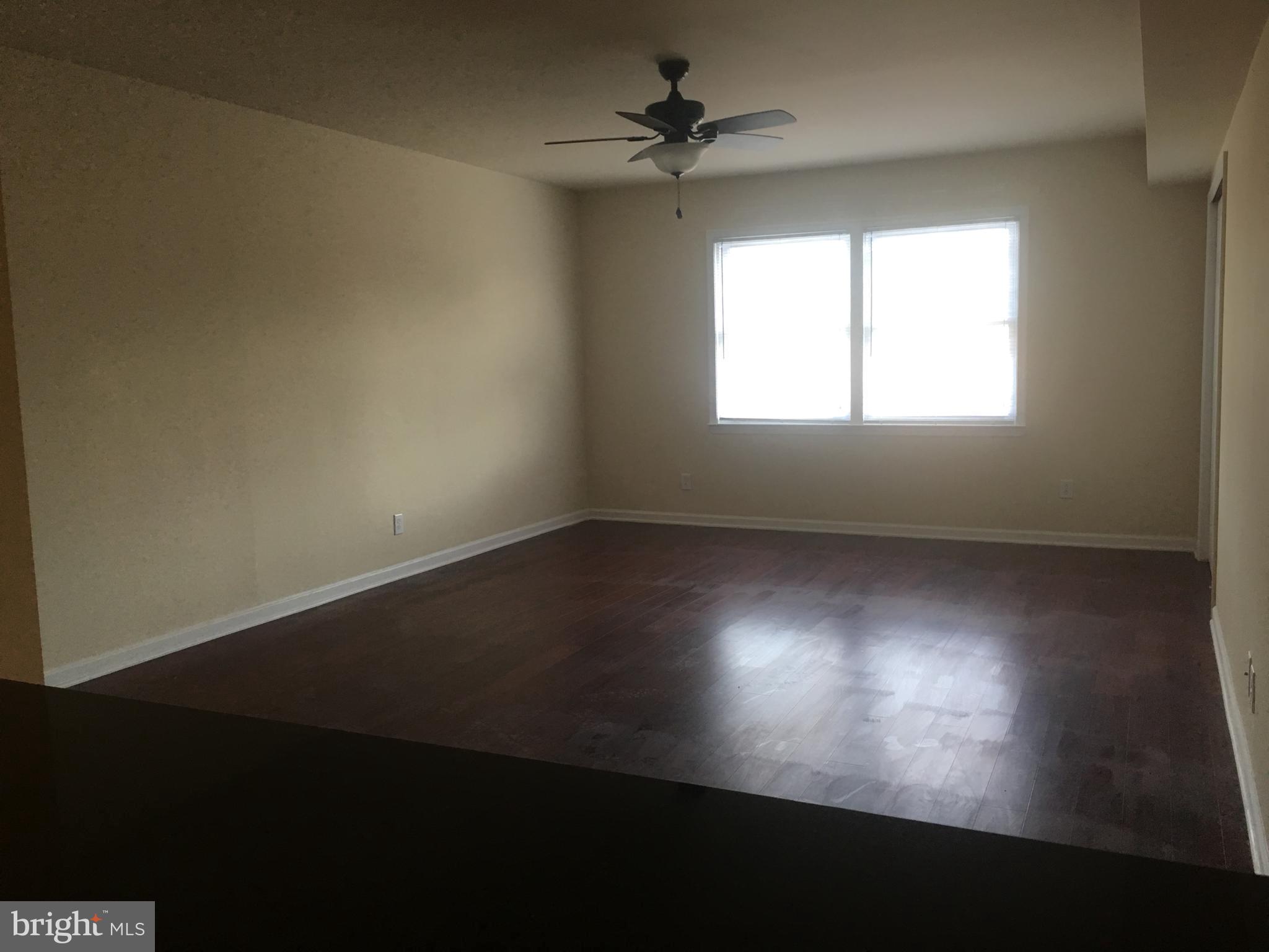 1 Pennsylvania Road, Unit 11 Glassboro, NJ 08028 - Photo 10 of 17 wooden floor in an empty room with a window