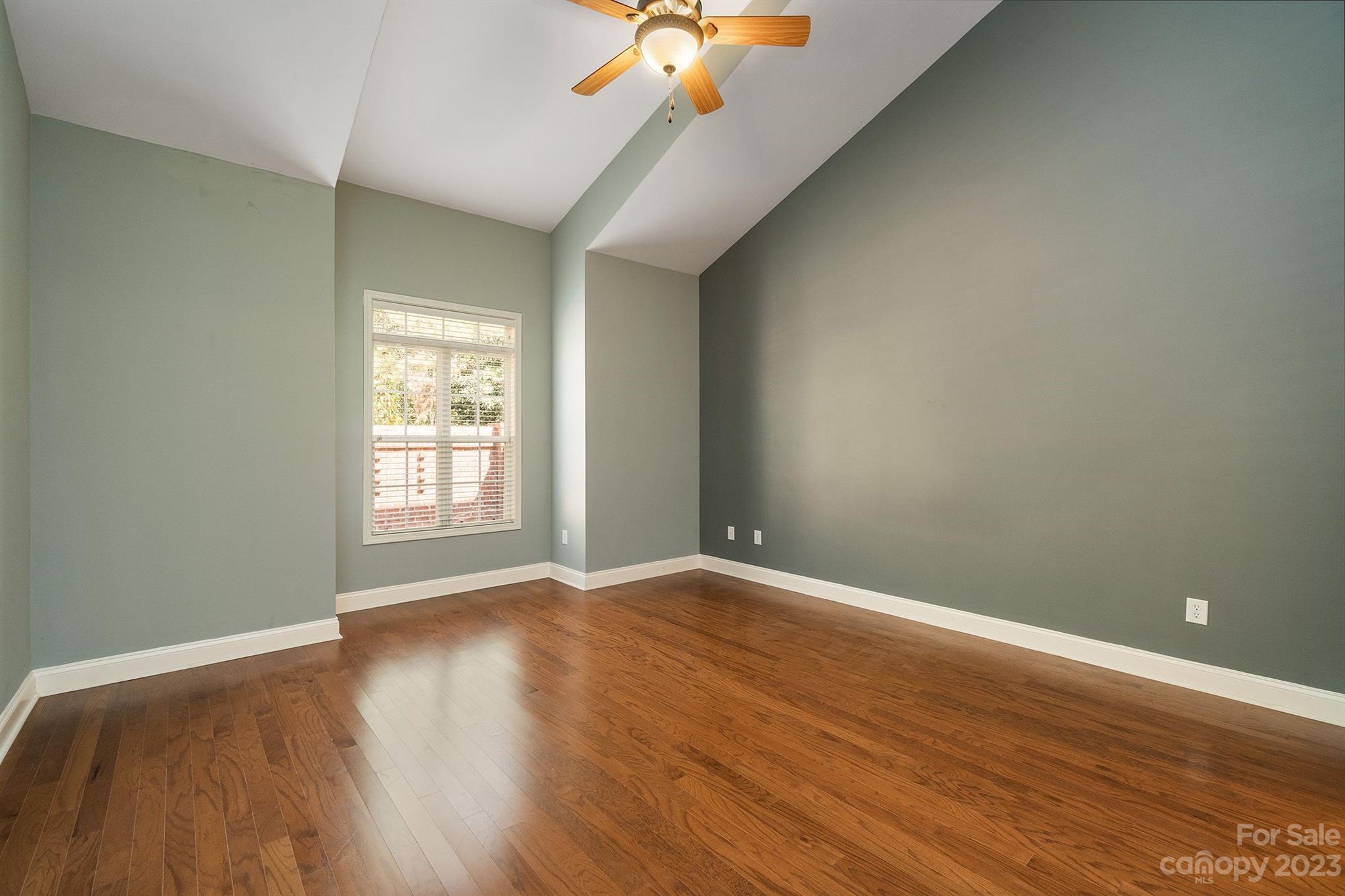 20232 Middletown Road Cornelius, NC 28031 - Photo 21 of 40 wooden floor in an empty room with a window