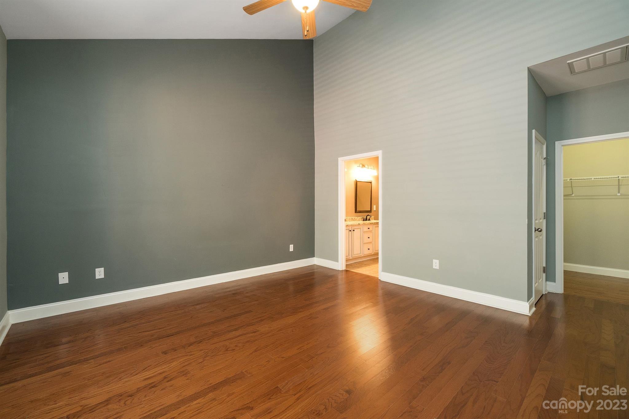 20232 Middletown Road Cornelius, NC 28031 - Photo 23 of 40 a view of an empty room with wooden floor