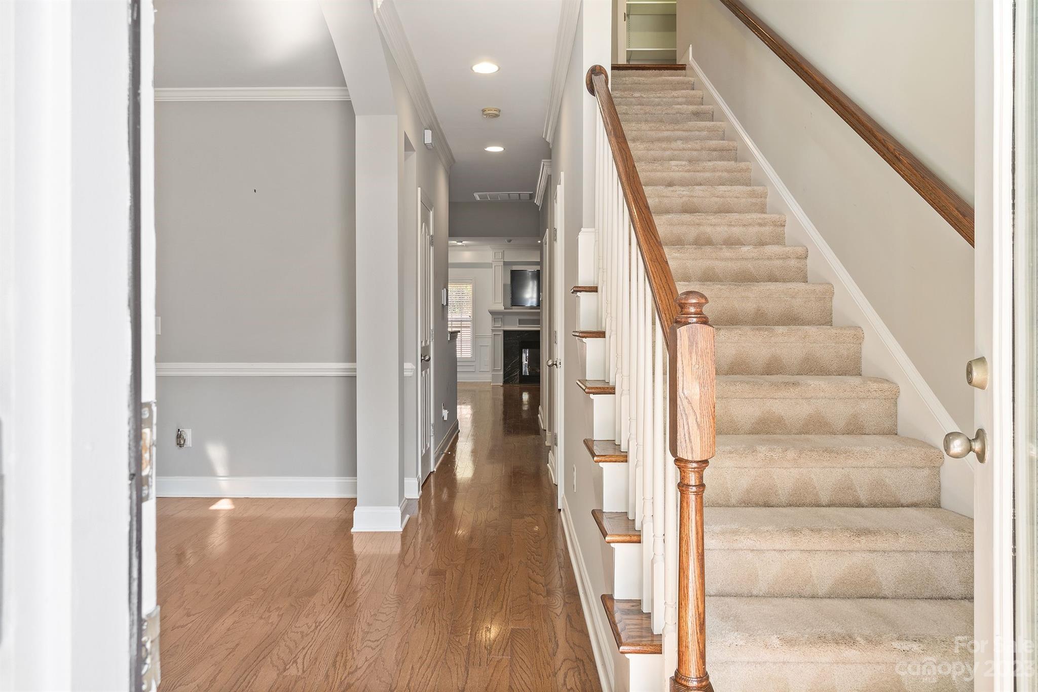 20232 Middletown Road Cornelius, NC 28031 - Photo 33 of 40 a view of a hallway with wooden floor and staircase