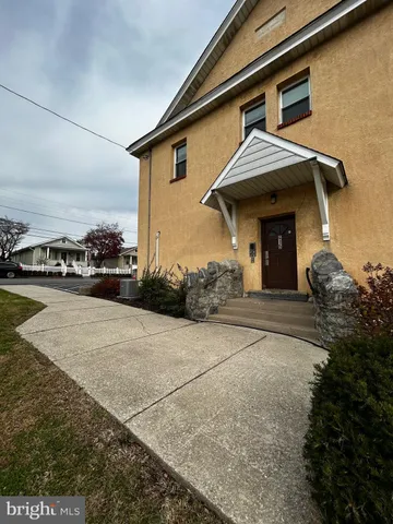 a view of a car parked in front of house