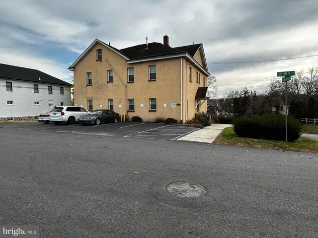 a kitchen with a sink stove and microwave