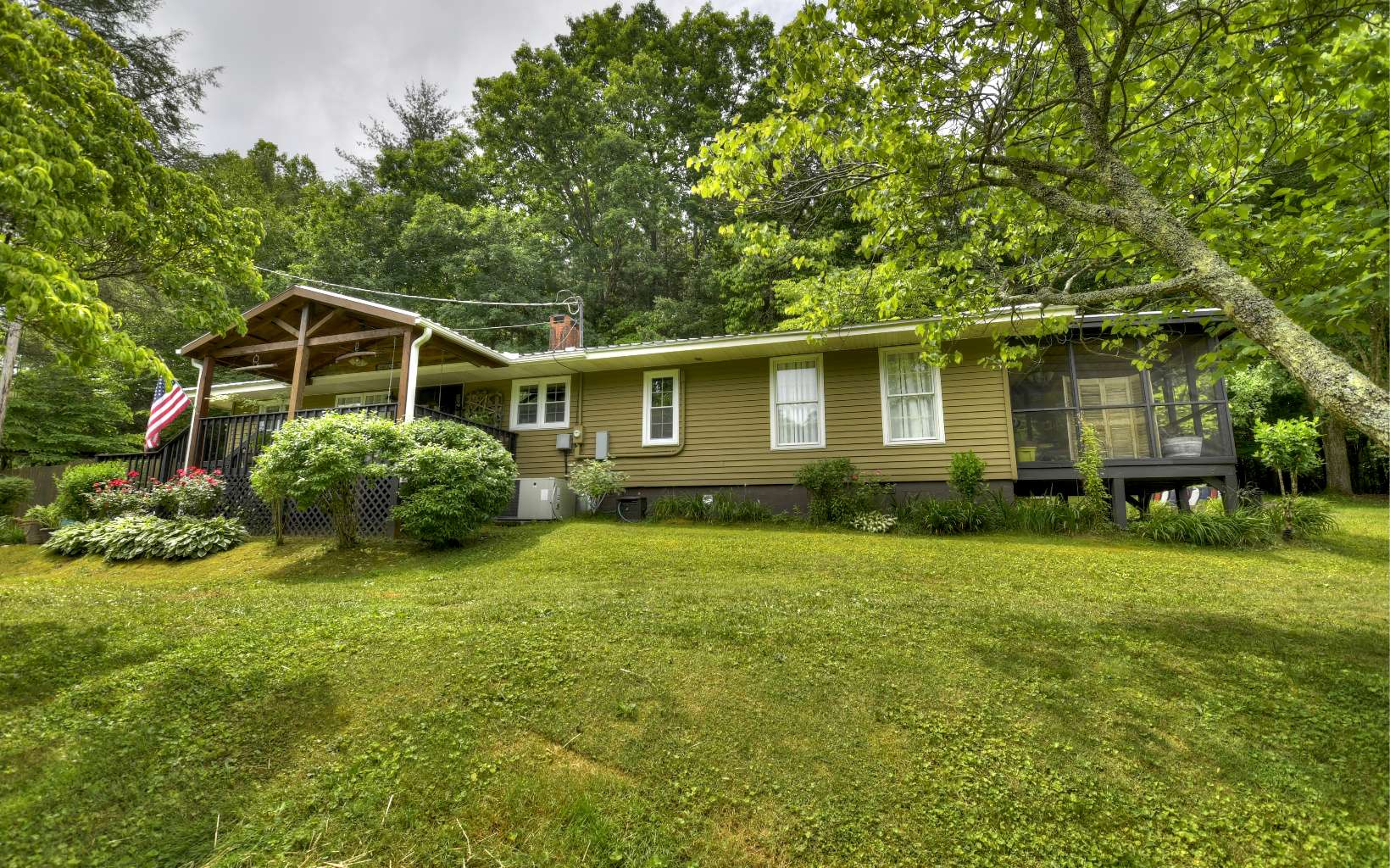 920 Tennis Court Road Blue Ridge, GA 30513 - Photo 1 of 56 a front view of a house with garden