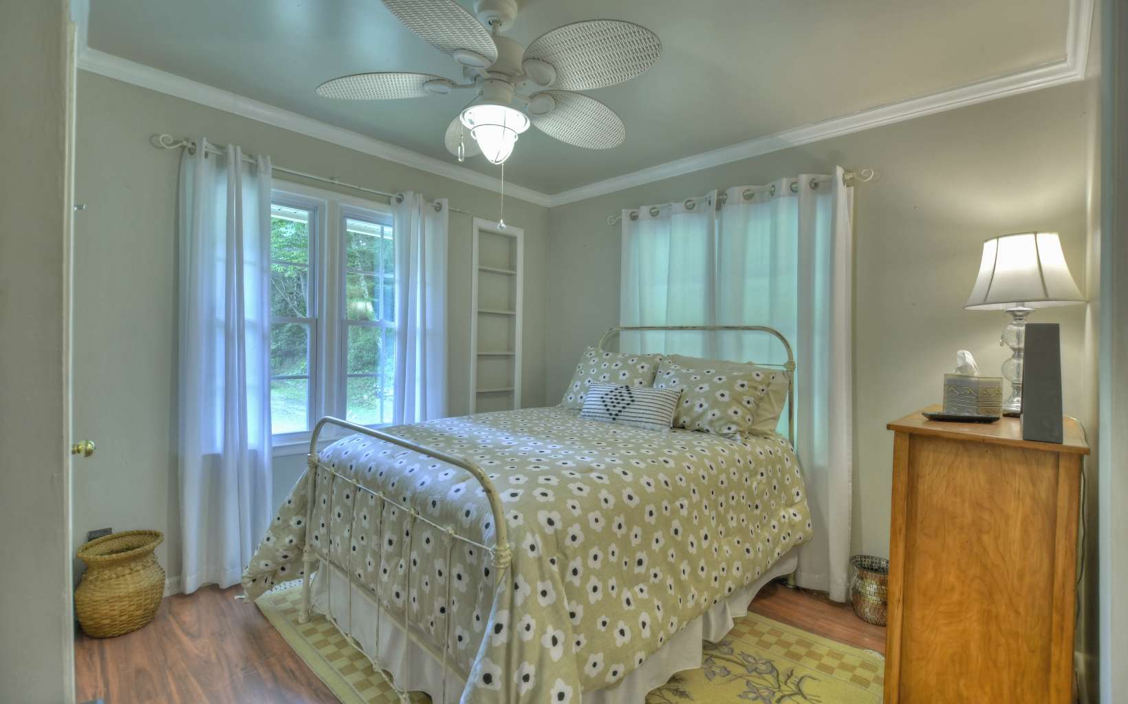 920 Tennis Court Road Blue Ridge, GA 30513 - Photo 17 of 56 a bedroom with a bed and a chandelier