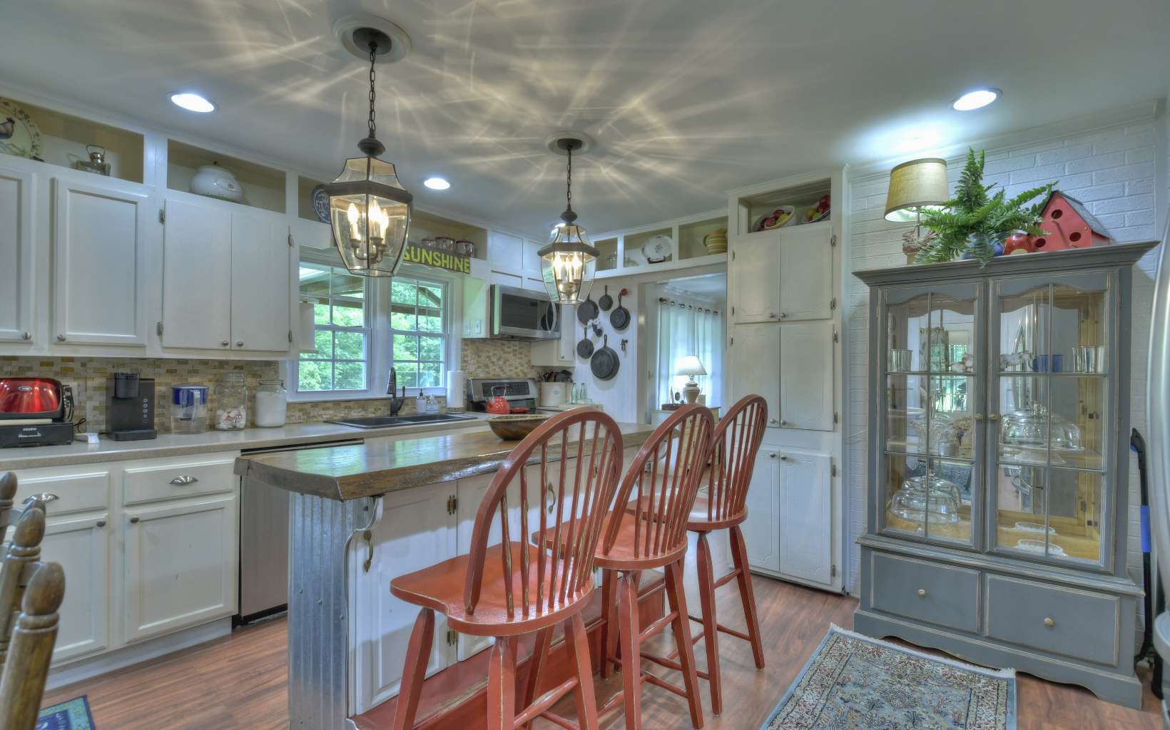 920 Tennis Court Road Blue Ridge, GA 30513 - Photo 21 of 56 a kitchen with stainless steel appliances granite countertop a kitchen island a stove and a cabinets