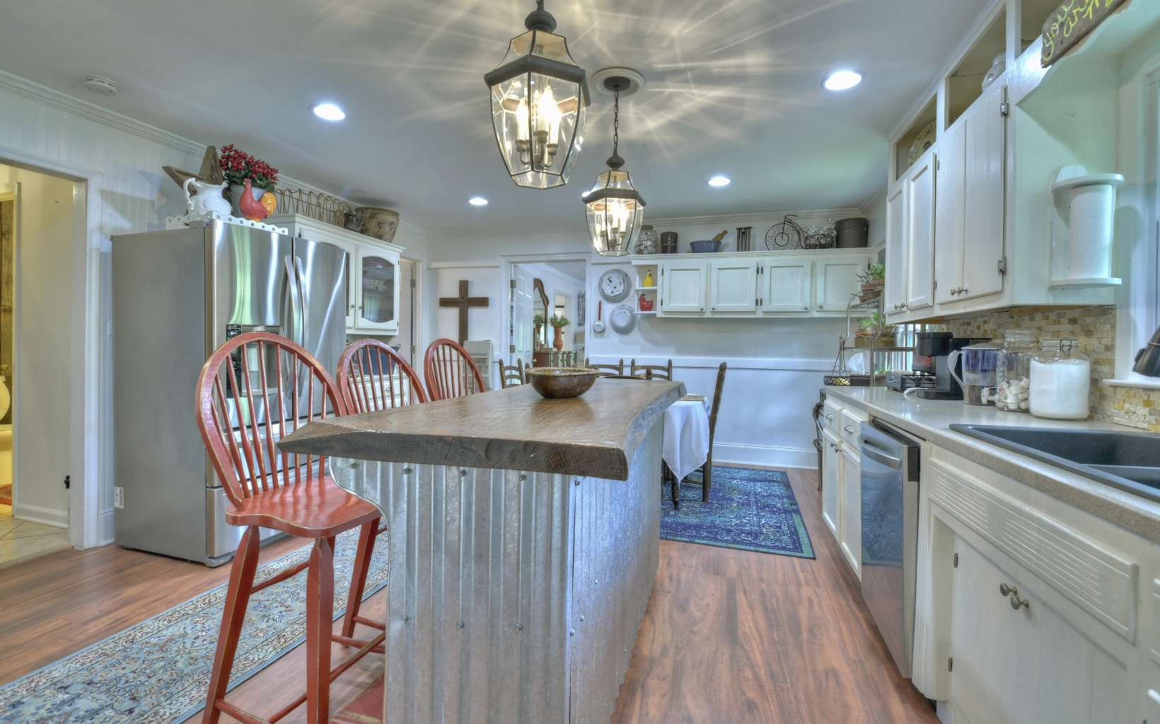 920 Tennis Court Road Blue Ridge, GA 30513 - Photo 23 of 56 a kitchen with stainless steel appliances granite countertop a kitchen island a stove a table and chairs