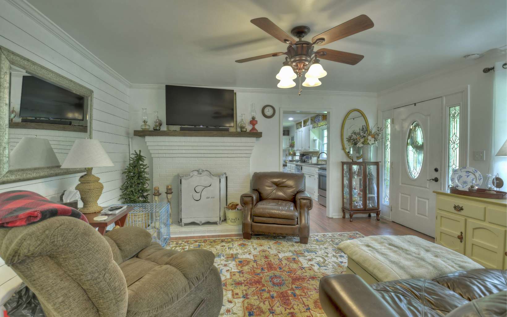 920 Tennis Court Road Blue Ridge, GA 30513 - Photo 26 of 56 a living room with furniture a flat screen tv and a fireplace