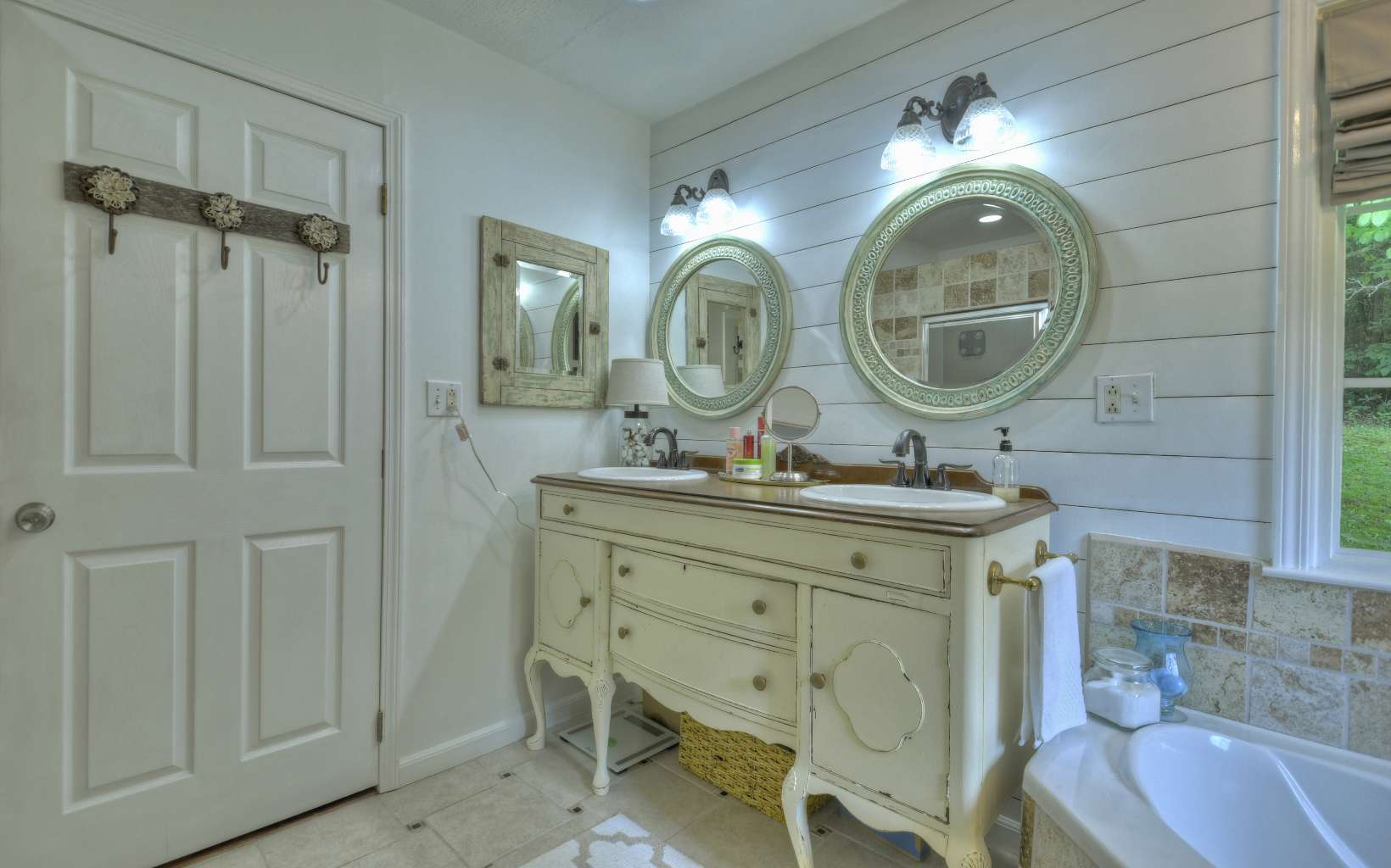 920 Tennis Court Road Blue Ridge, GA 30513 - Photo 9 of 56 a bathroom with a double vanity sink and a mirror