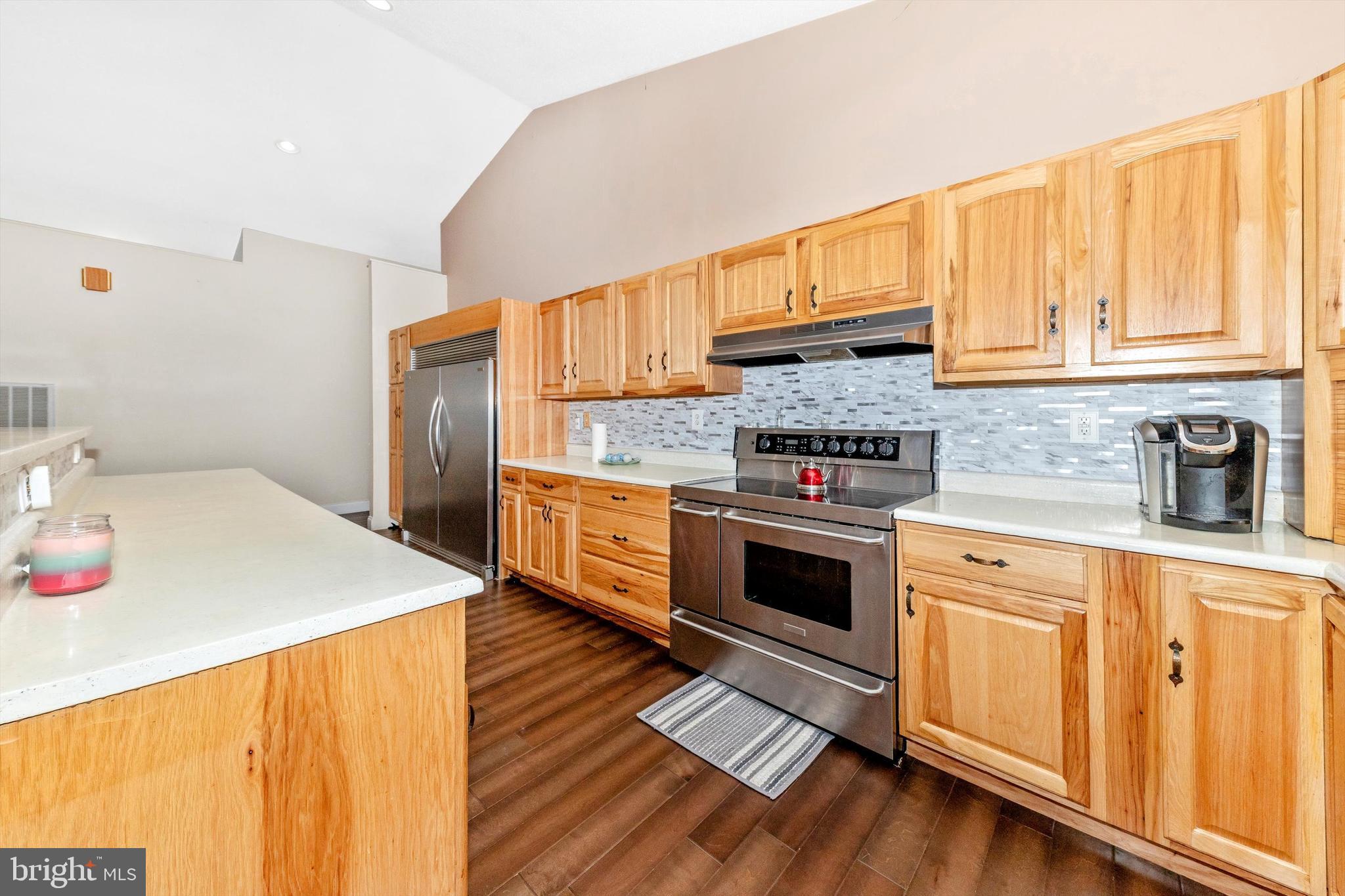 13450 Millstone Circle Hancock, MD 21750 - Photo 13 of 61 a kitchen with stainless steel appliances granite countertop a stove a sink and a refrigerator