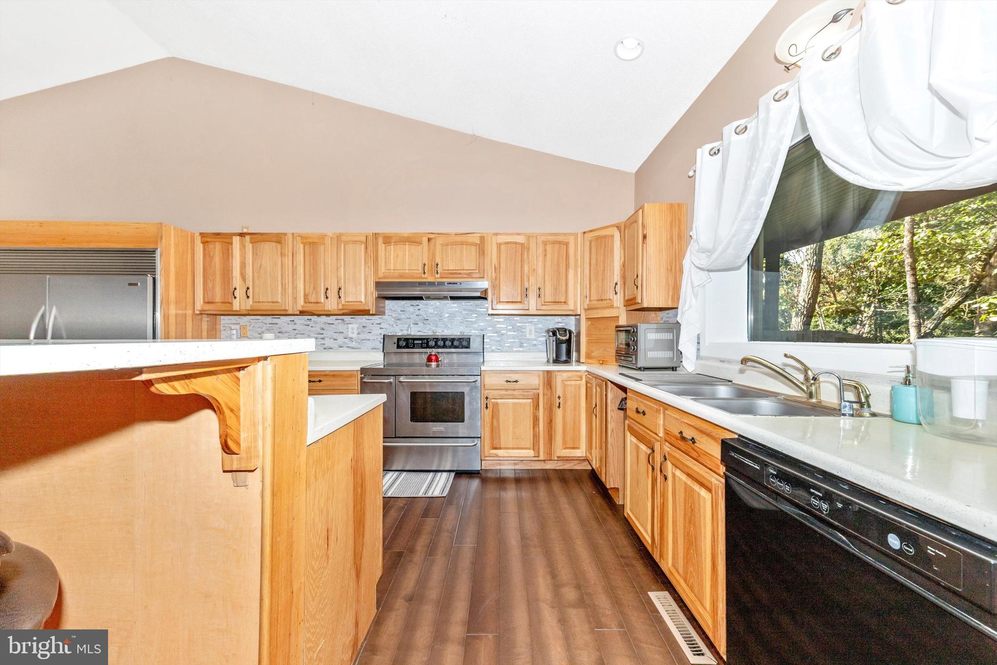 13450 Millstone Circle Hancock, MD 21750 - Photo 14 of 61 a kitchen with stainless steel appliances a sink dishwasher stove and oven with cabinets