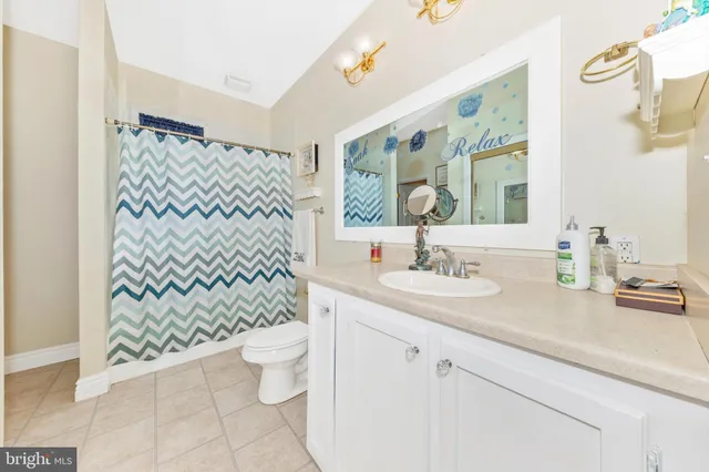 a view of a a dining room with furniture window and wooden floor
