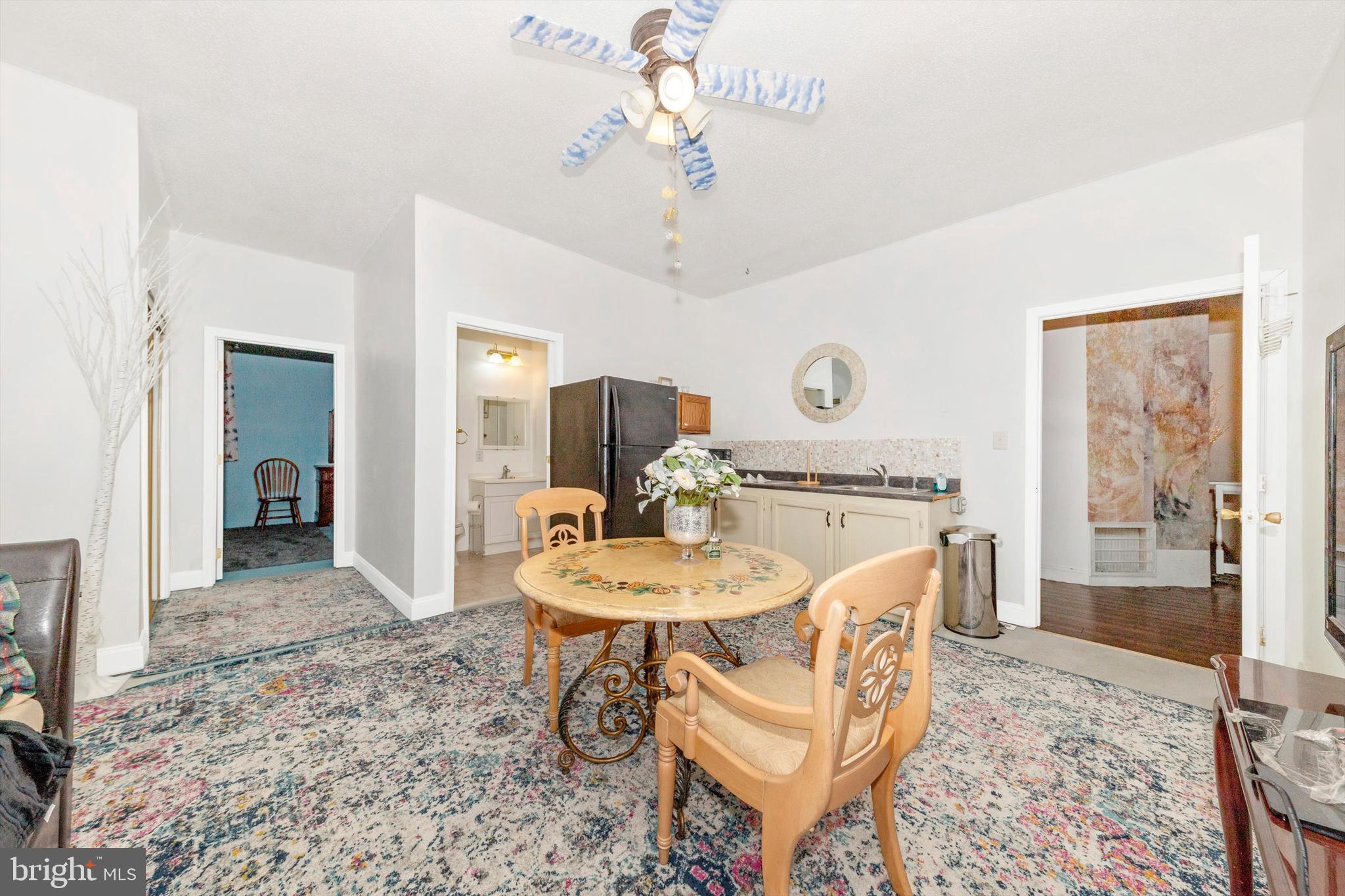 13450 Millstone Circle Hancock, MD 21750 - Photo 26 of 61 a view of a a dining room with furniture window and wooden floor