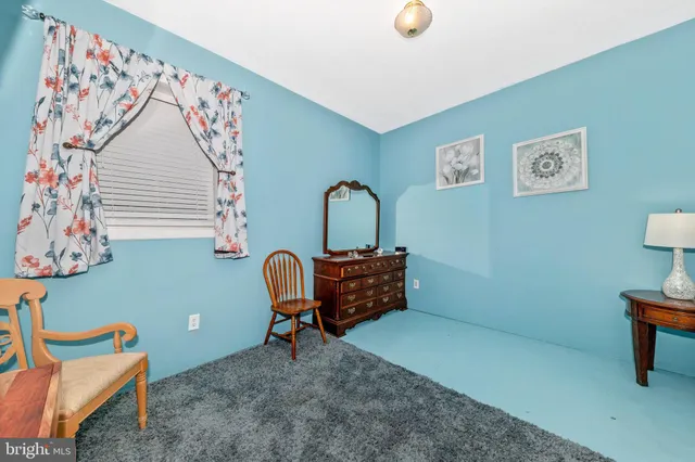 a bathroom with a sink mirror and toilet