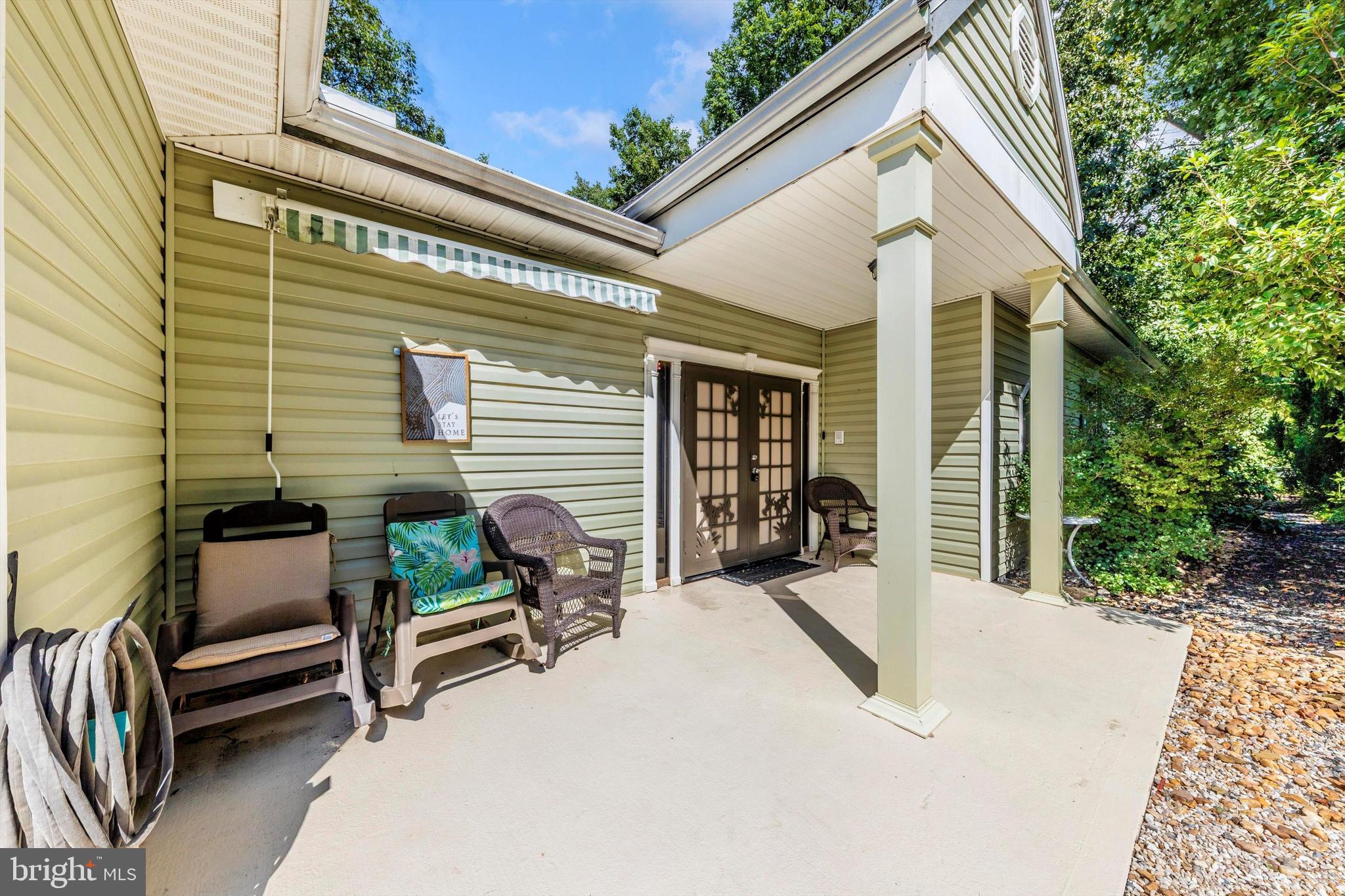 13450 Millstone Circle Hancock, MD 21750 - Photo 44 of 61 a view of a patio with a table and chairs and wooden fence